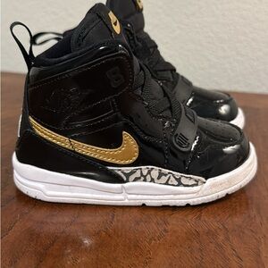 Kids Black and Gold High-Top Jordan Sneakers